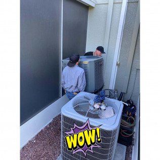 Two Man Carrying Big Aircon — Lithia, Fl — JS Watson Air