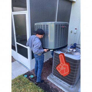 Man Opening Big Aircon — Lithia, Fl — JS Watson Air