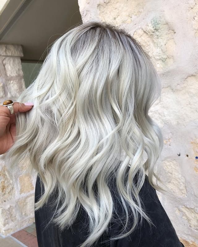 Woman with wavy, platinum blonde hair.