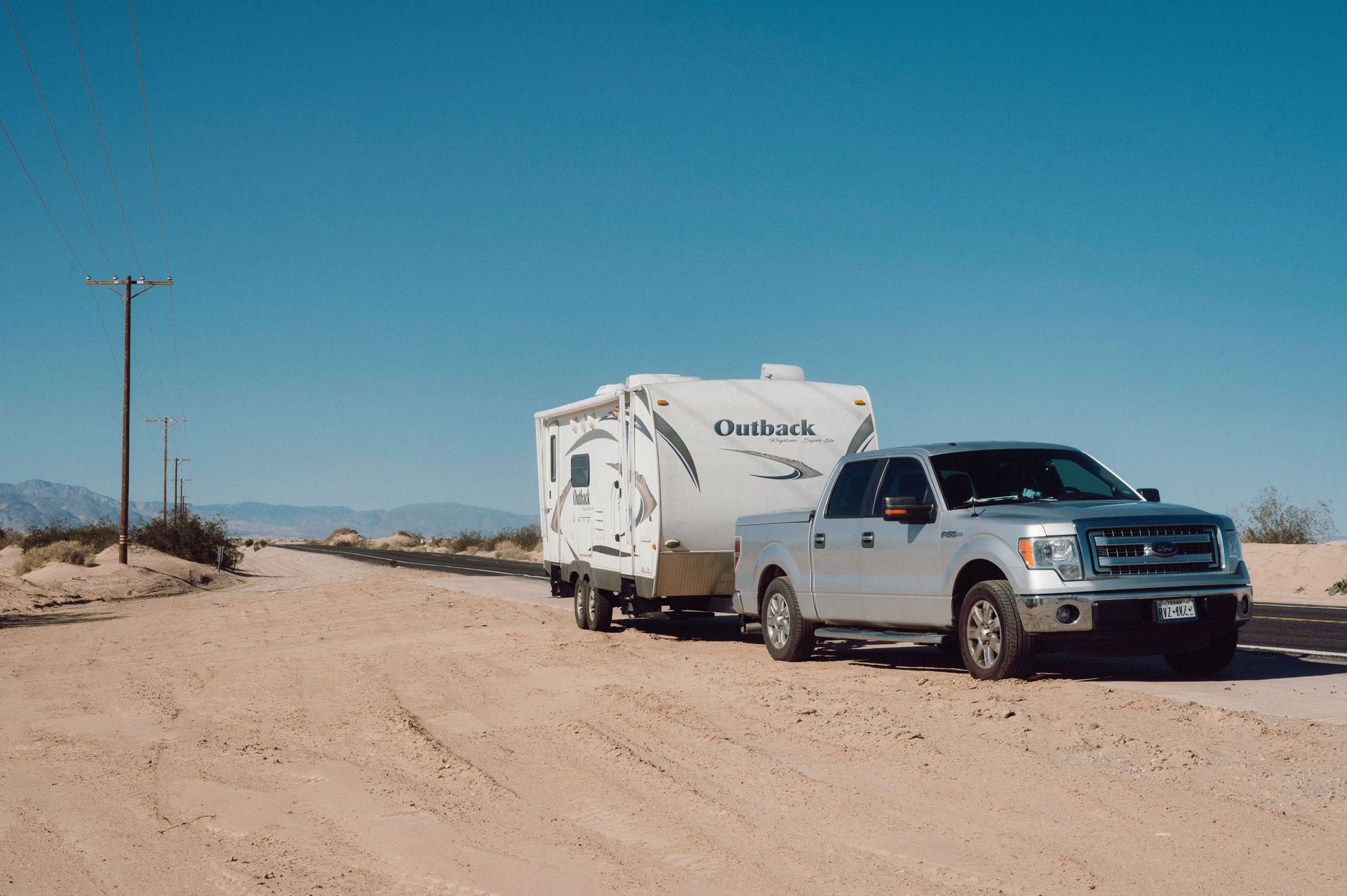 A truck towing a camper