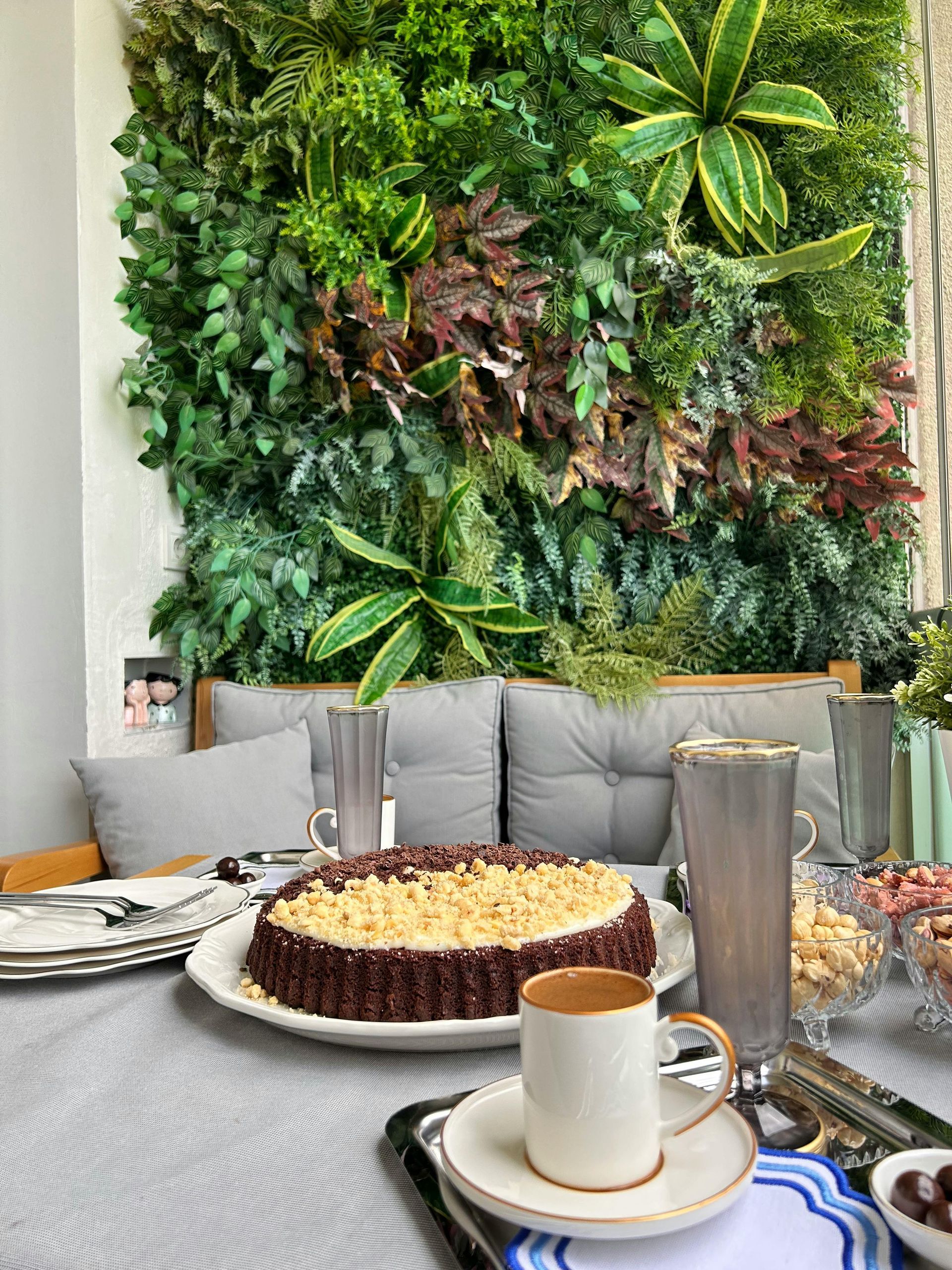 A table topped with plates of food and a cup of coffee.