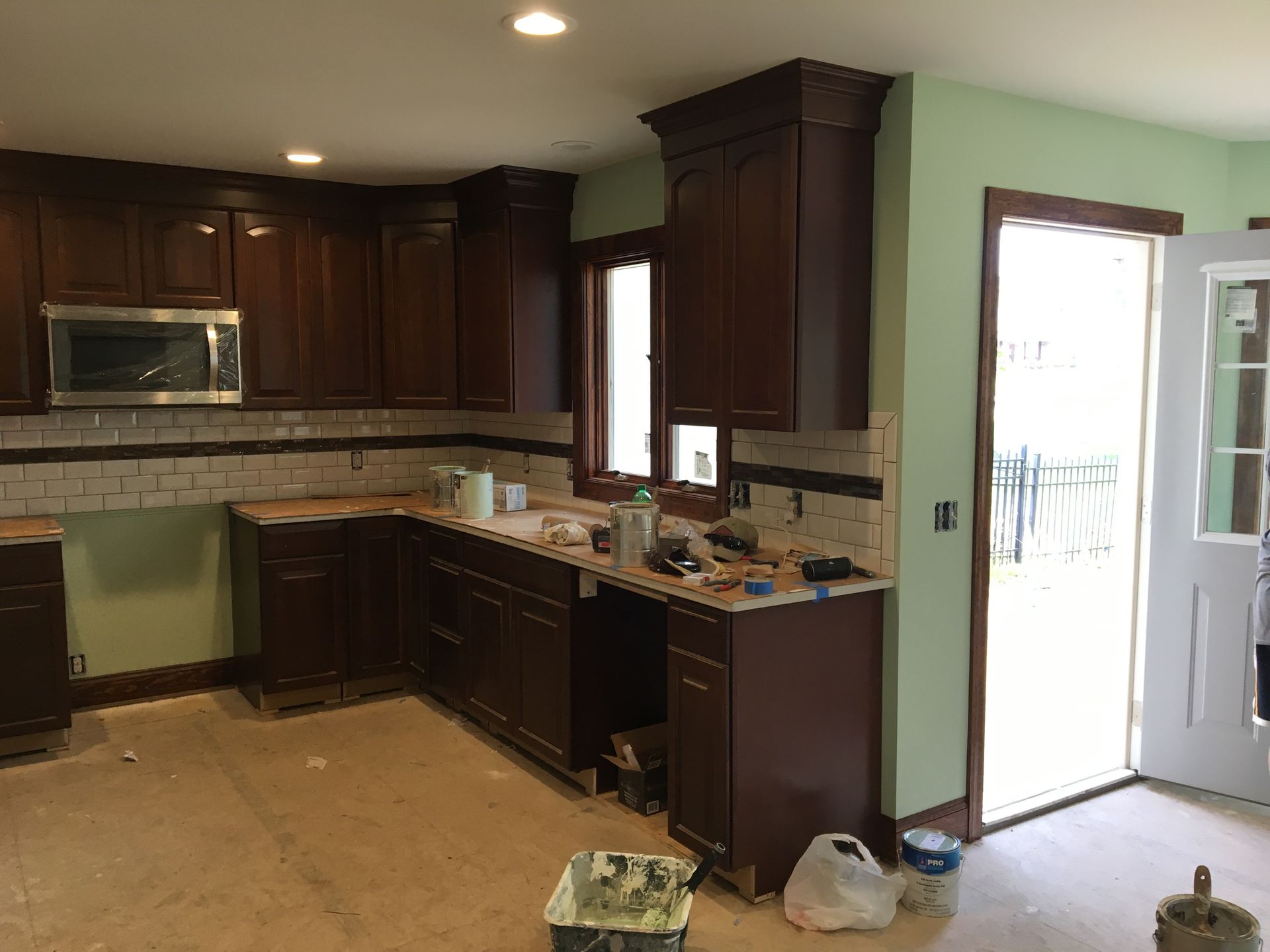 Luxurious marble bathroom with glass shower, double sinks, and a bathtub.