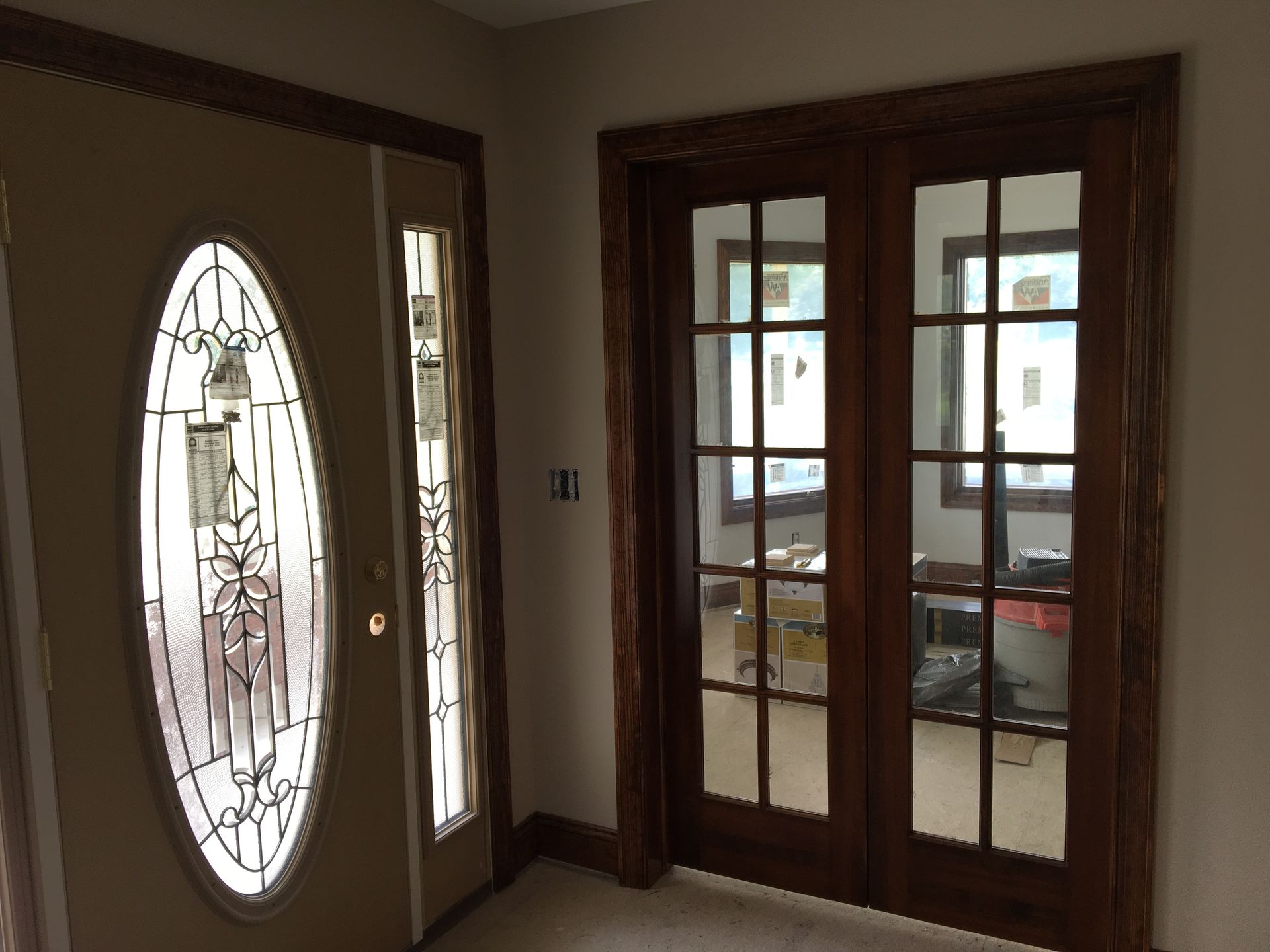 Gray kitchen with stainless steel appliances, cabinets, and a white countertop.