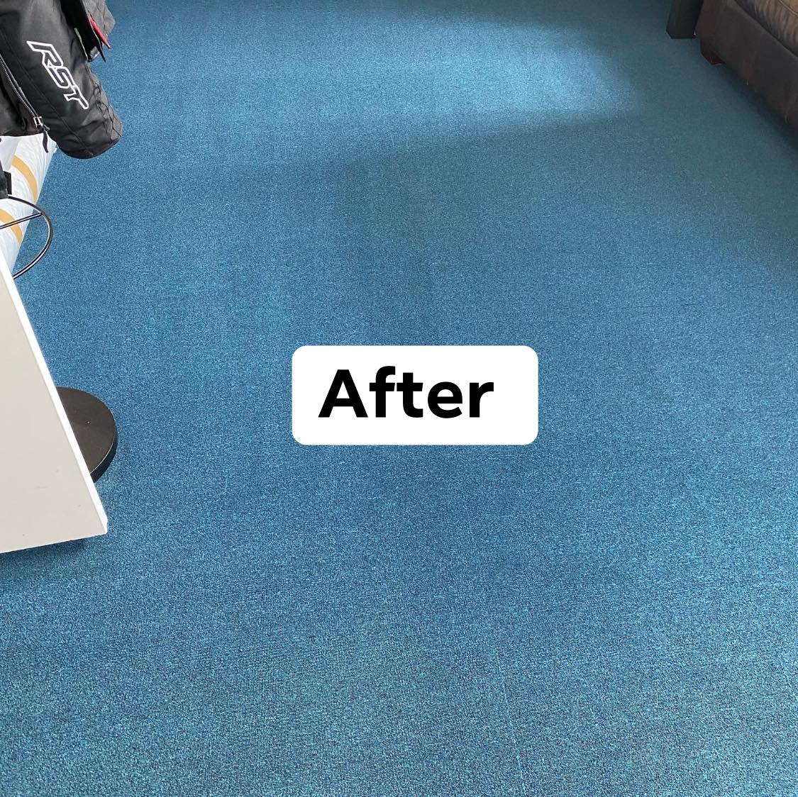 a picture of a blue carpet with a sign that says 