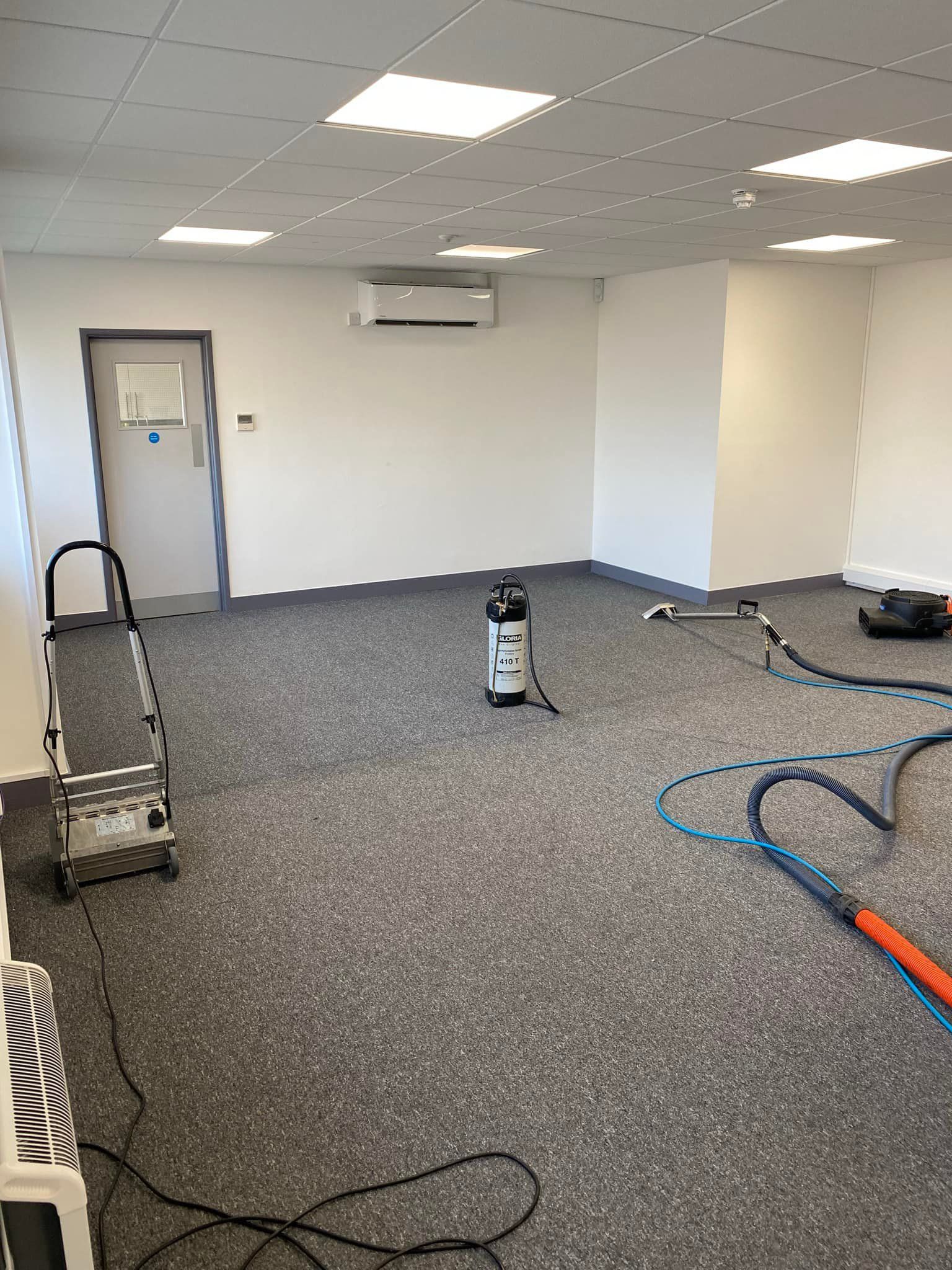 there is a vacuum cleaner in the middle of the room .