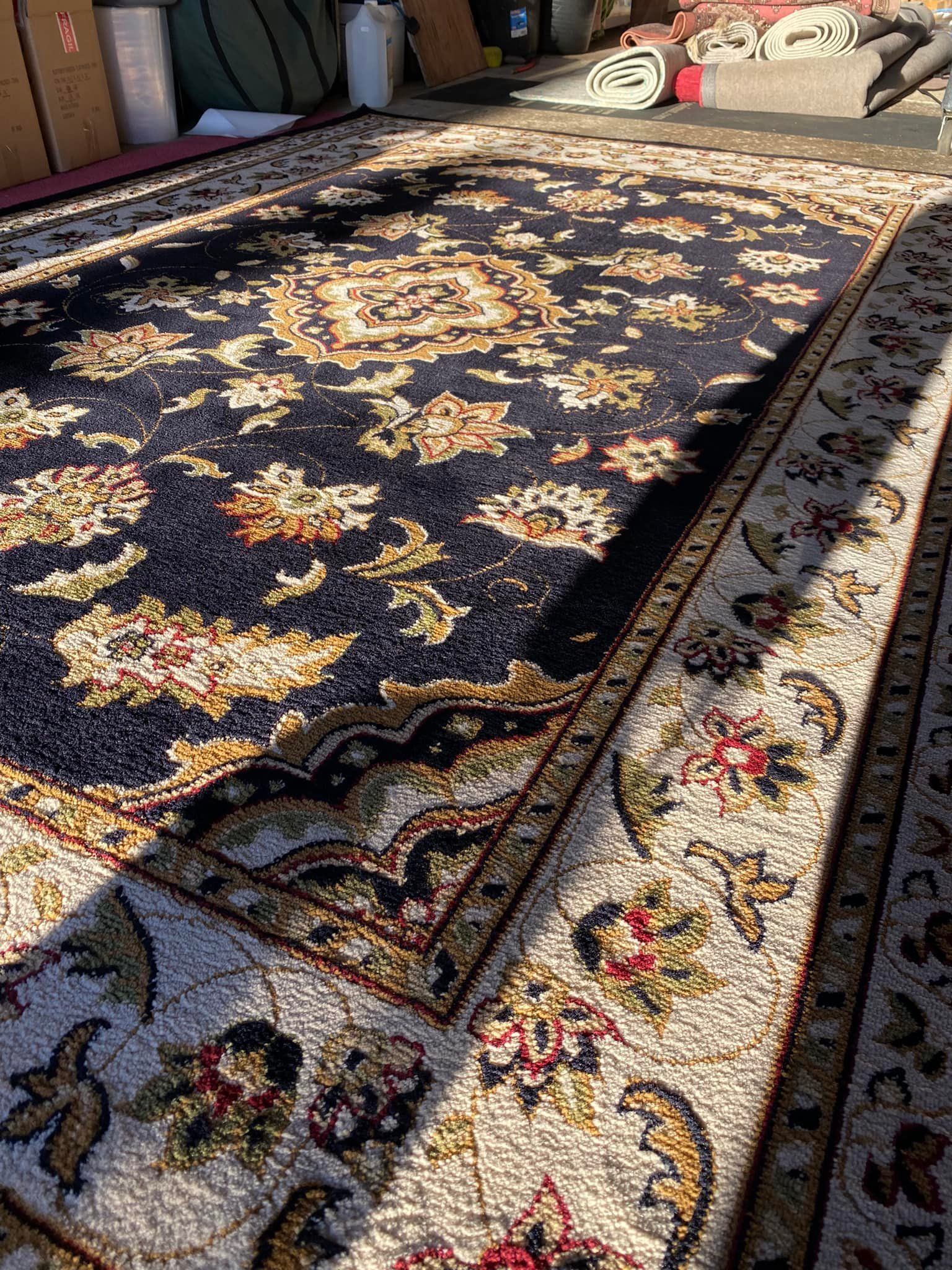 a rug with a floral pattern is sitting on the floor in a room .