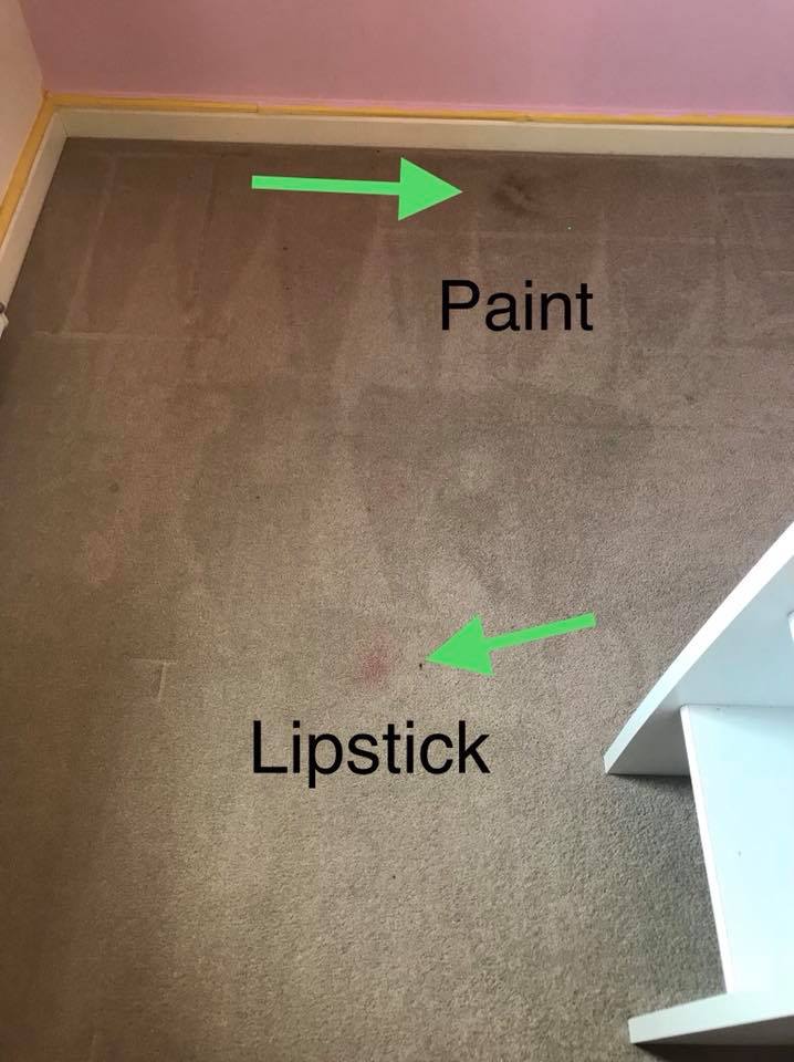 a picture of a carpet with paint and lipstick on it .