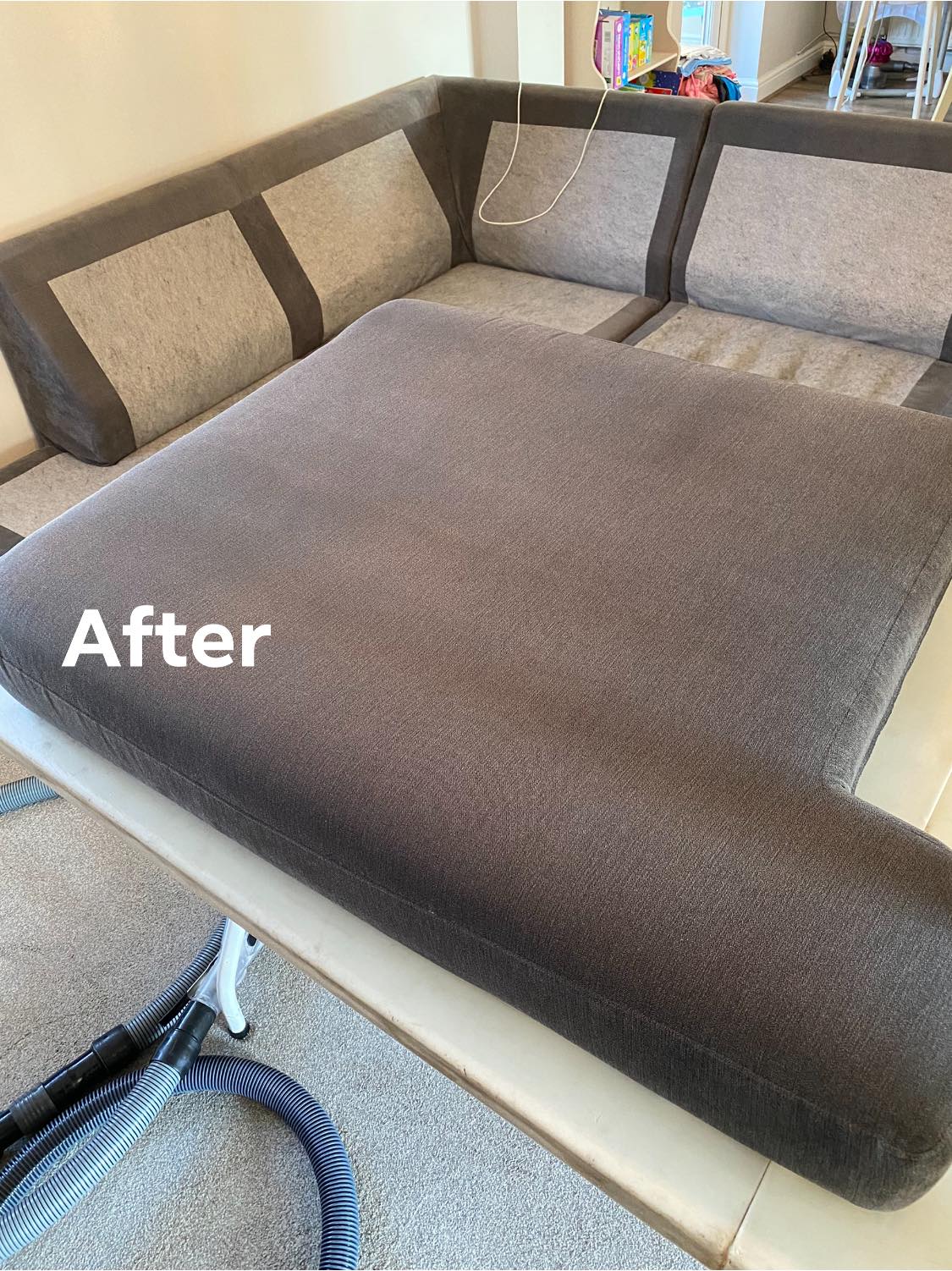 a couch is sitting on top of a carpet in a living room .