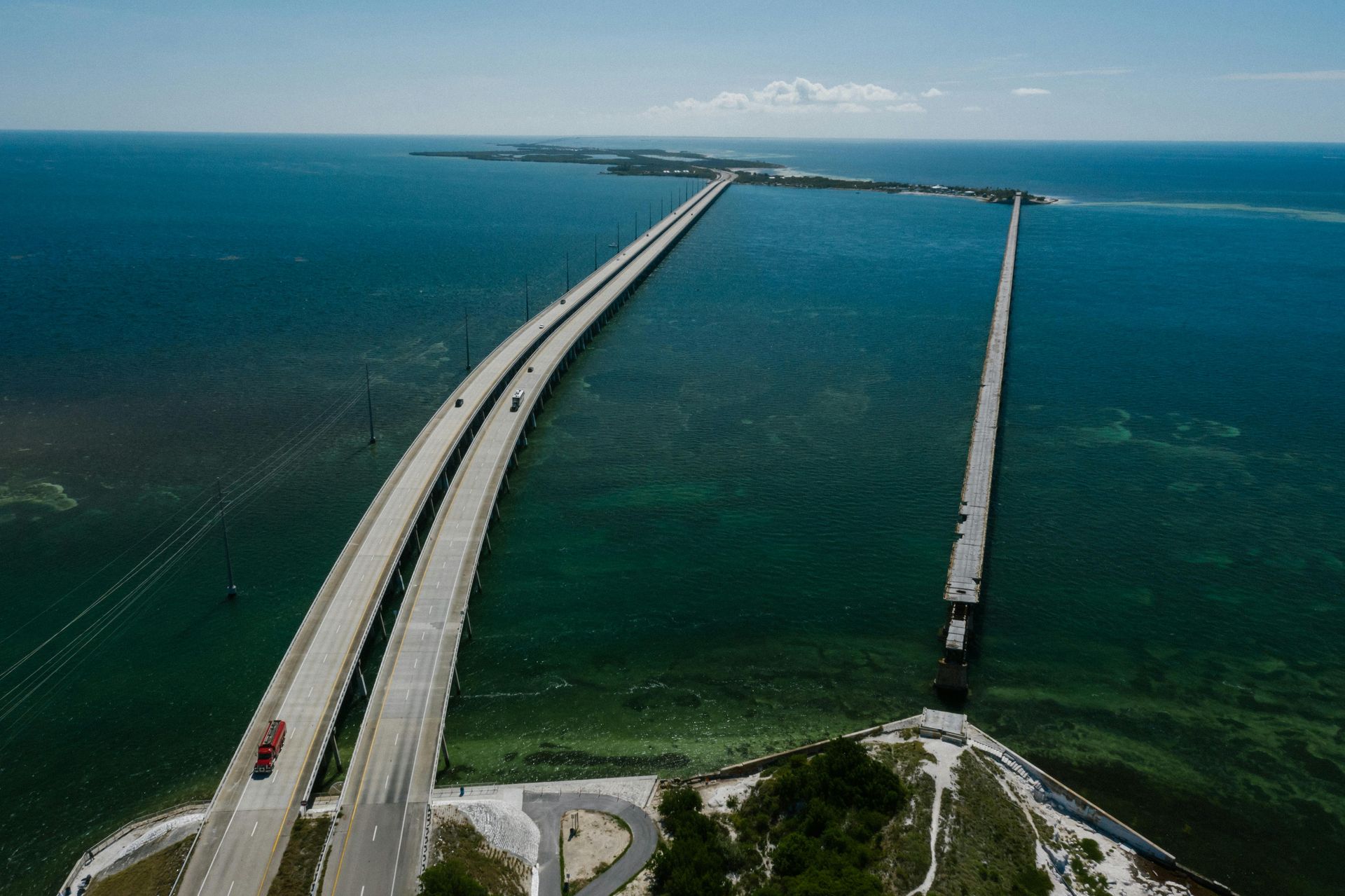 An aerial view of a bridge over a body of water.