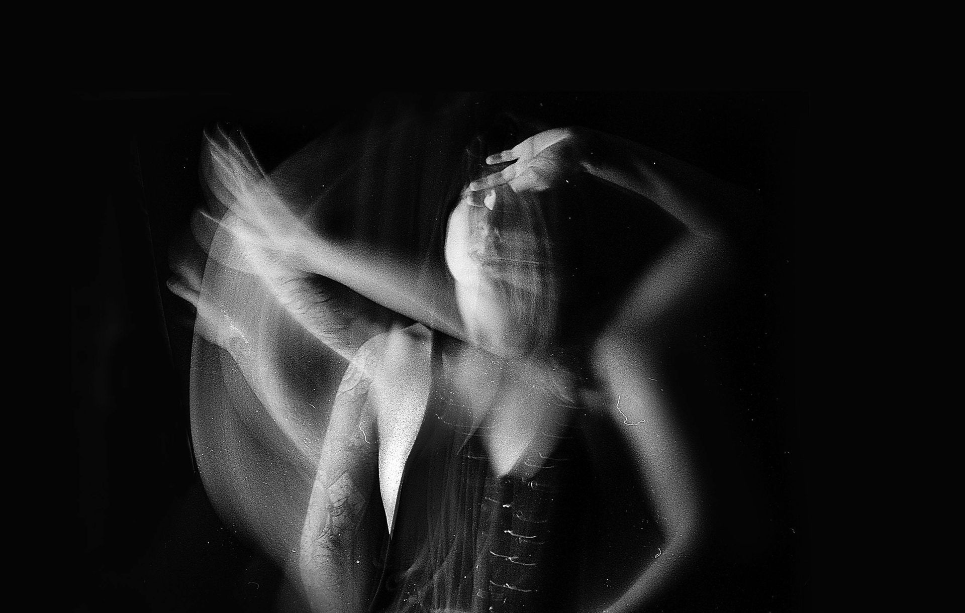 Somatic healing. Black and white image of multiple exposures of a person. 