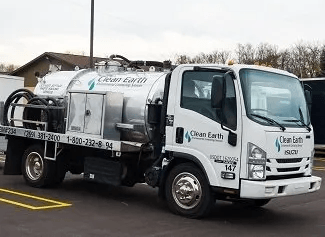 White Clean Earth truck parked, ready for septic services.