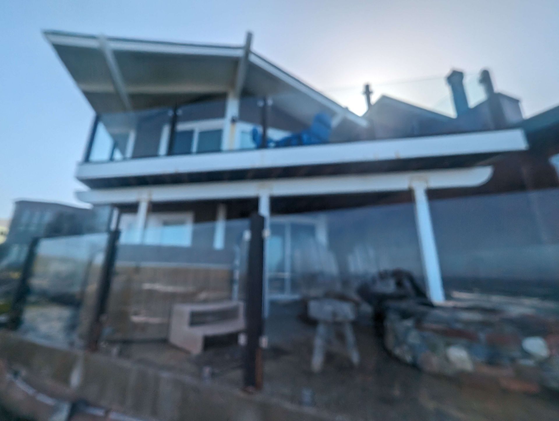 Blurry picture of a house with a balcony