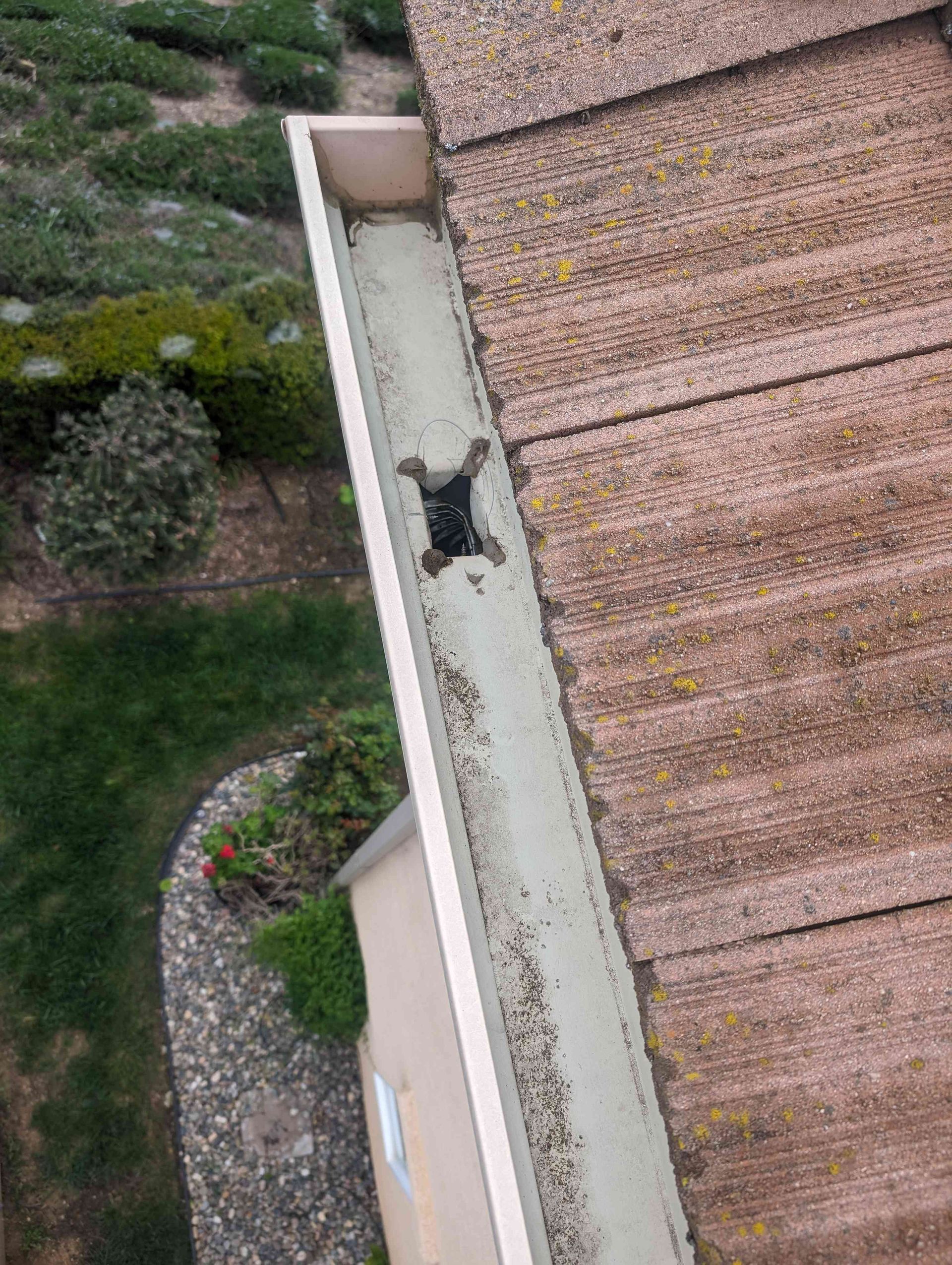 Aerial view of a gutter on the roof of a house.