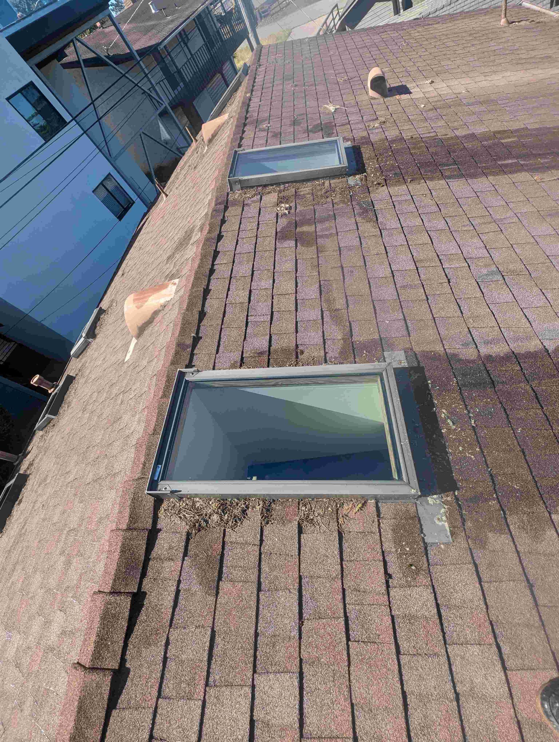 There is a skylight on the roof of a building.