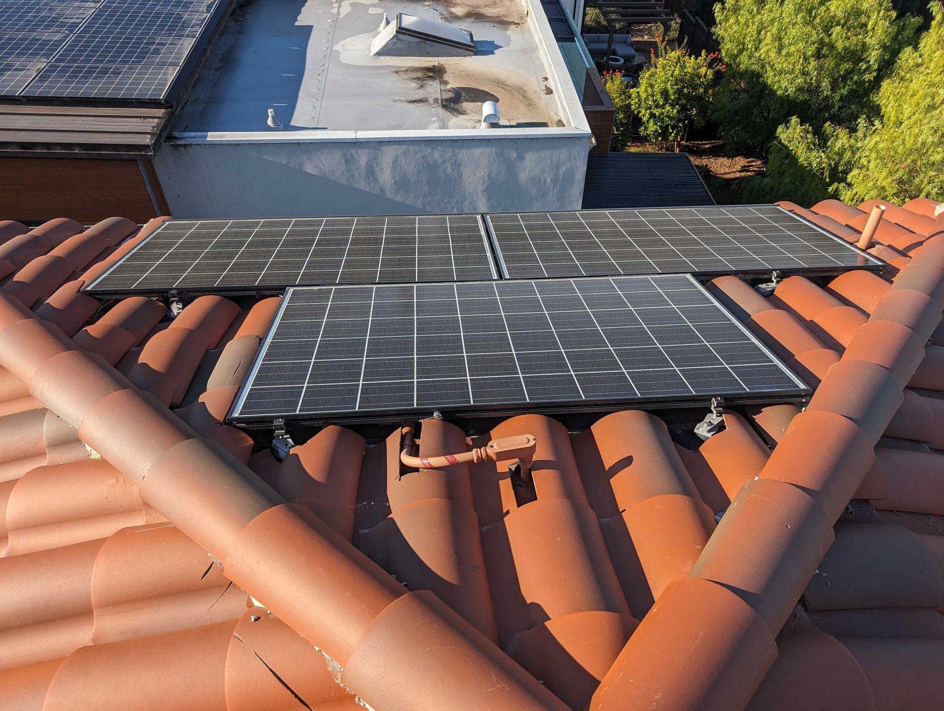 A roof with a lot of solar panels on it