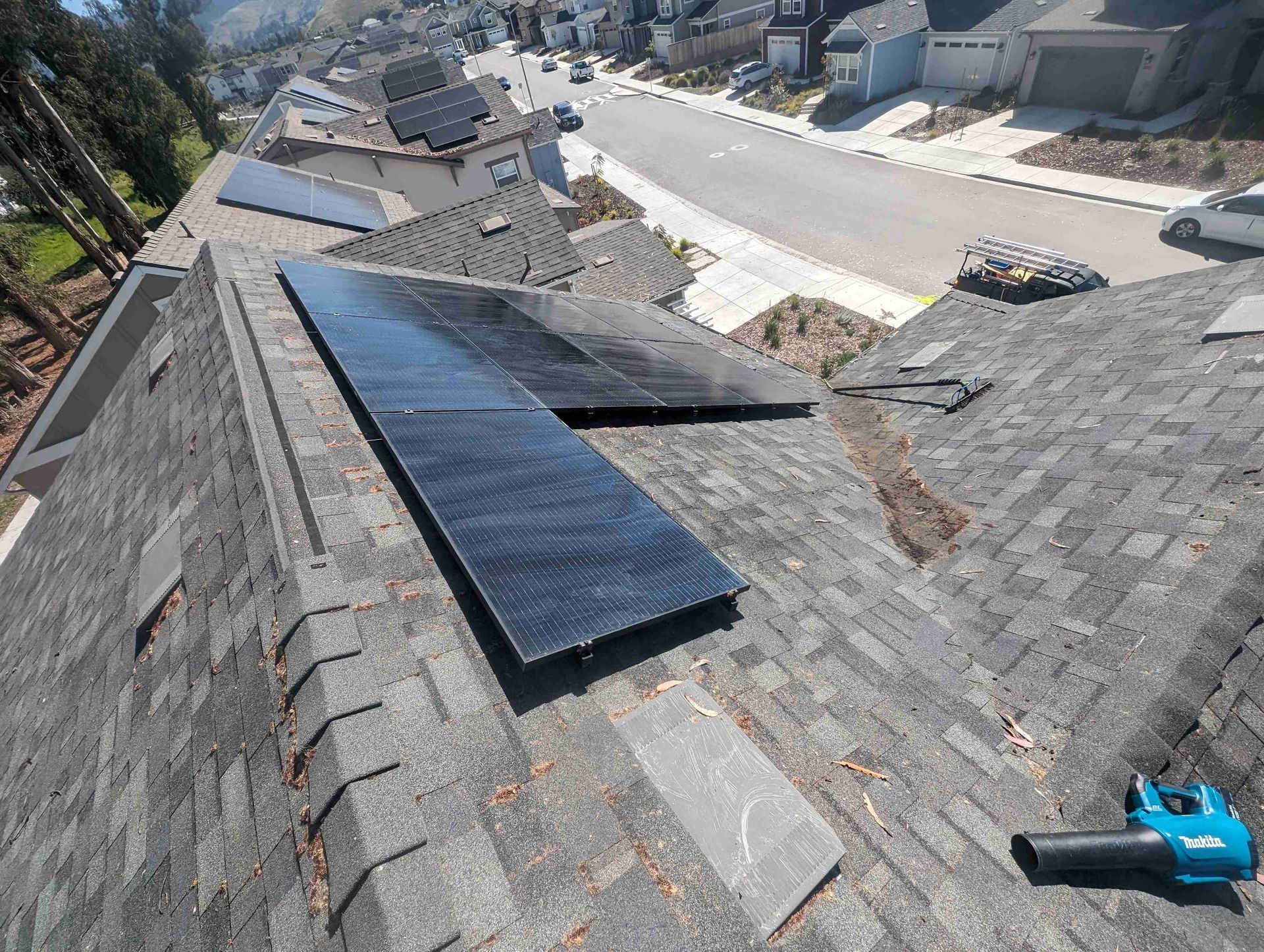 Bunch of solar panels are sitting on top of a roof.