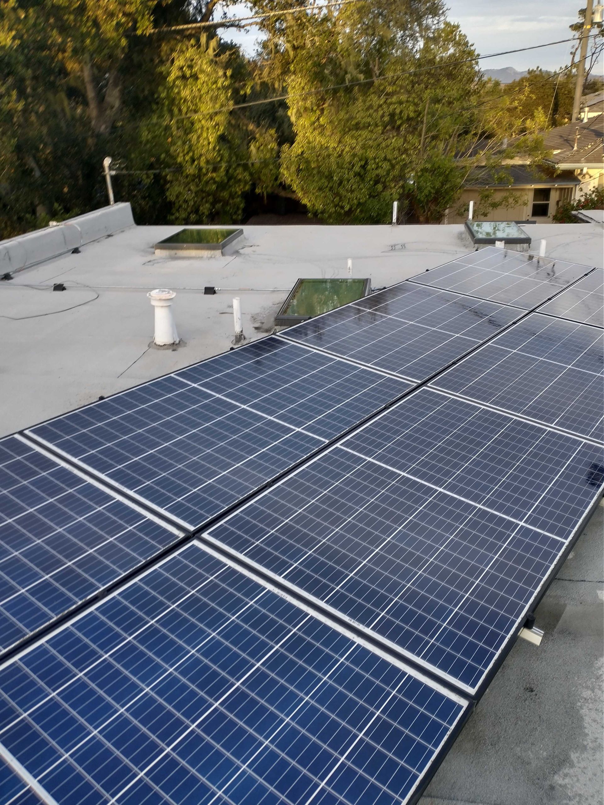 A roof with a lot of solar panels on it
