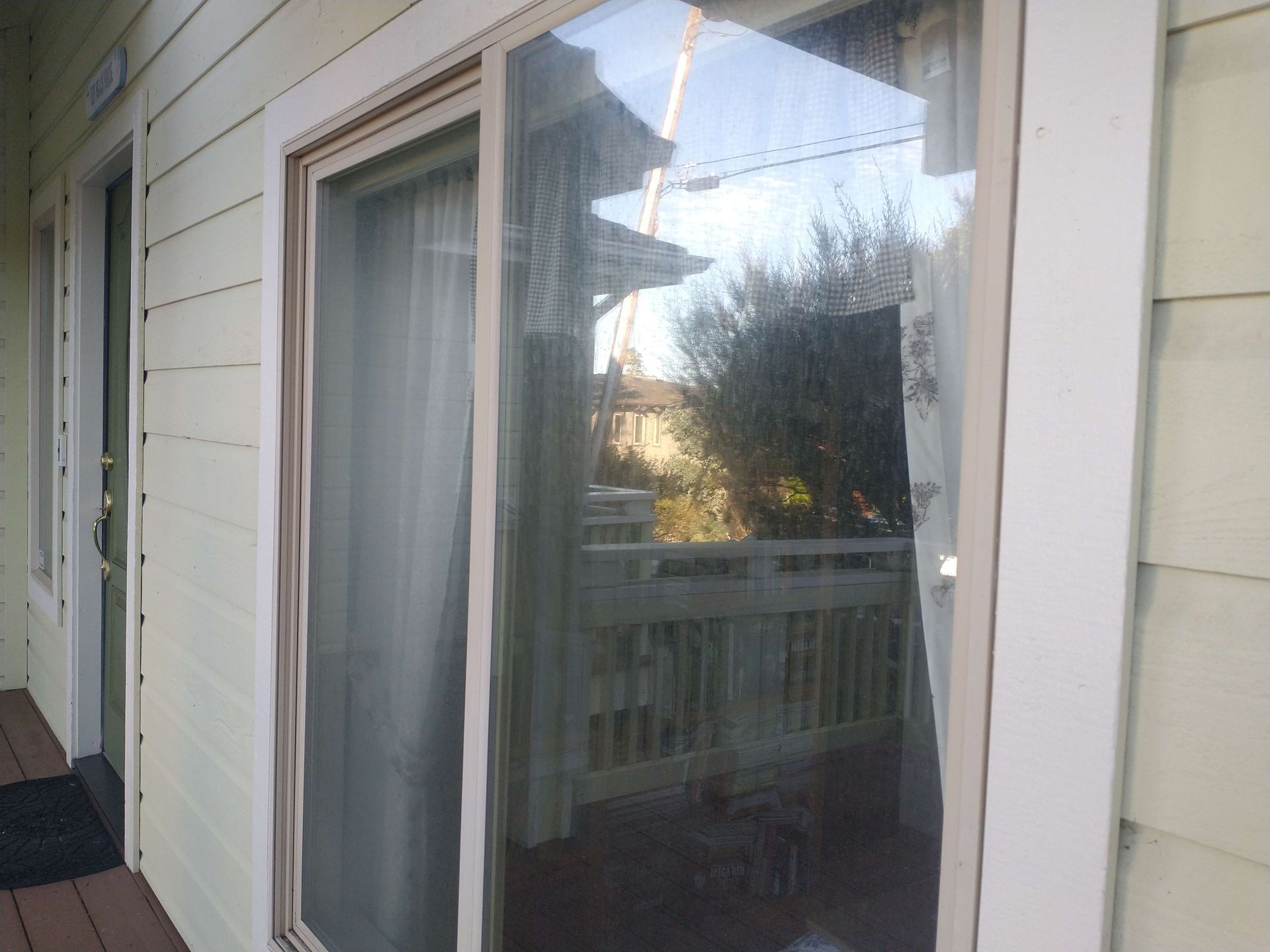 A white house with a sliding glass door