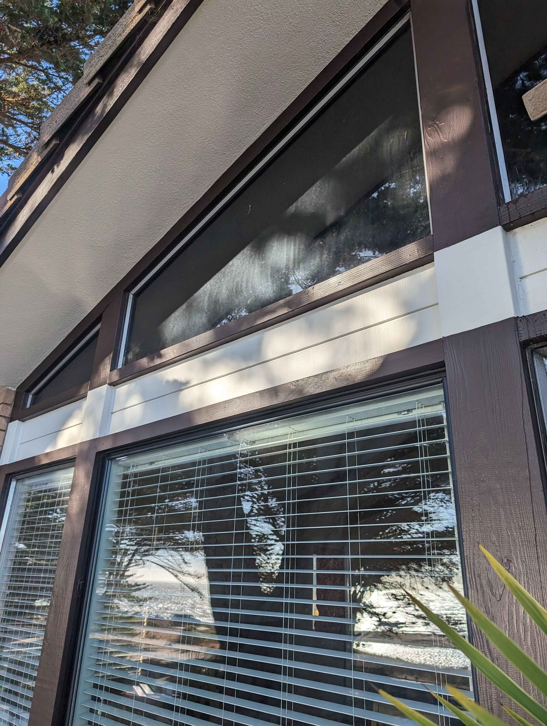 A close up of a window with blinds on it.
