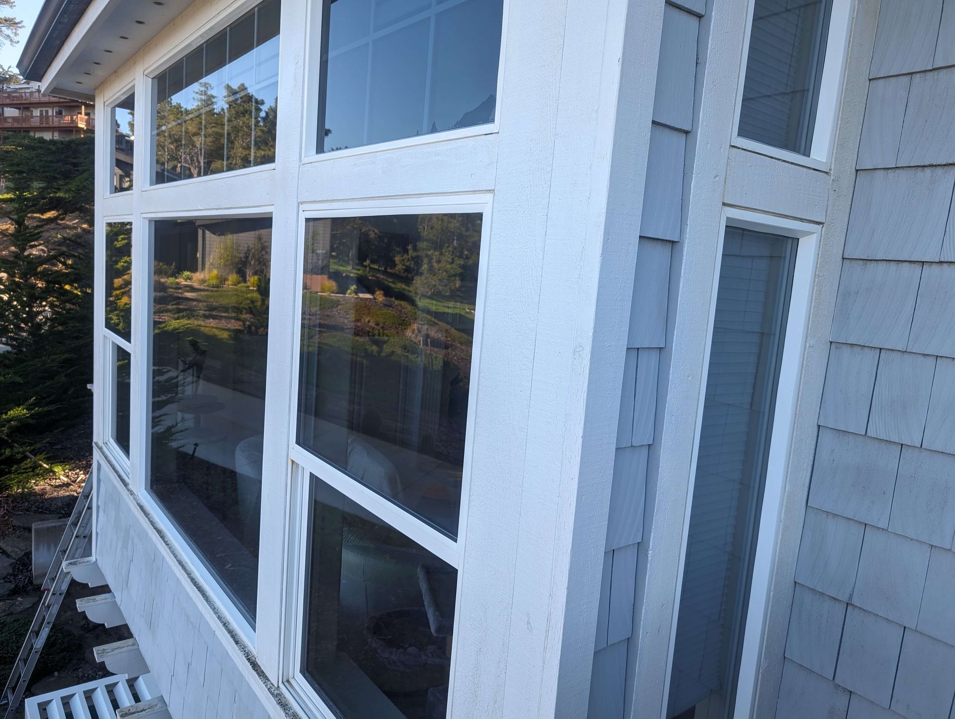 A white house with a lot of windows on it