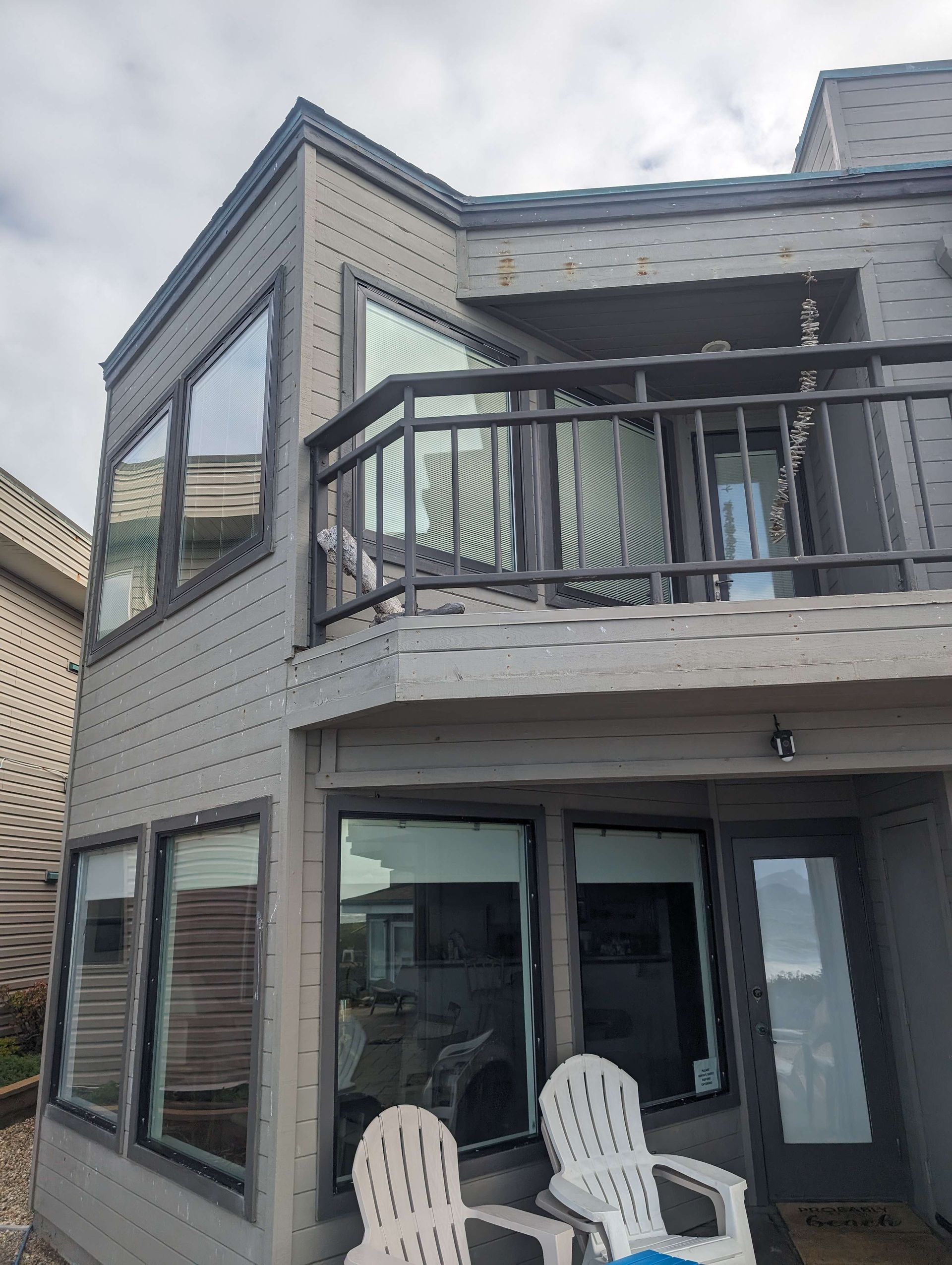 A large house with a balcony and a lot of windows.