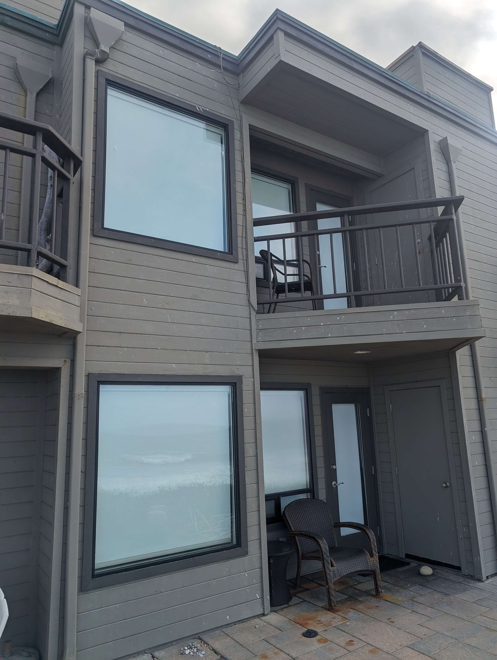 A large house with a balcony and a lot of windows.