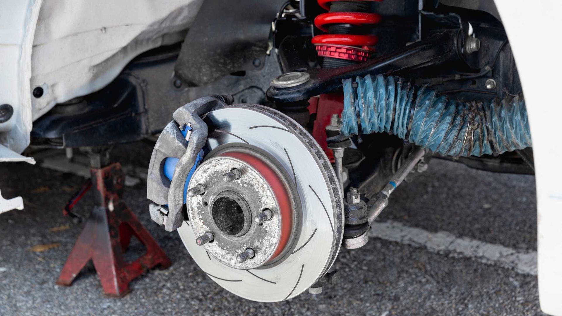 A close up of a brake disc on a car.