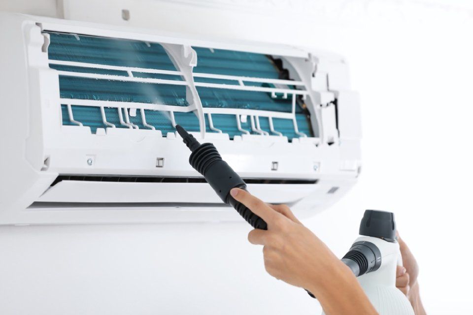 cleaning of air conditioner in progress