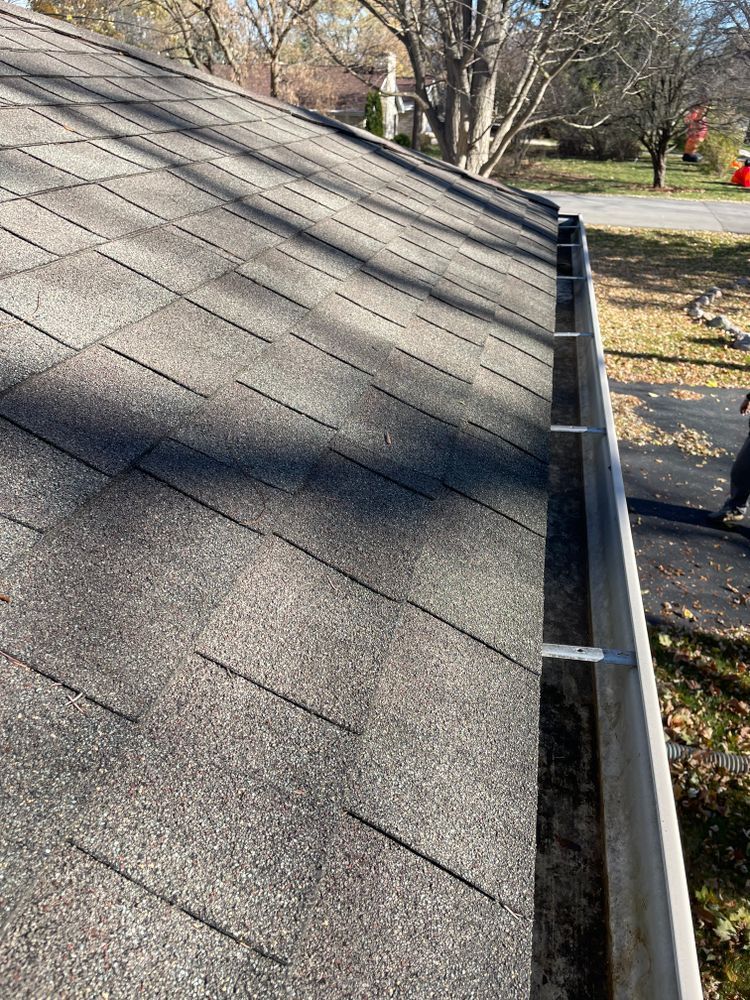 A close up of a roof with a gutter on it