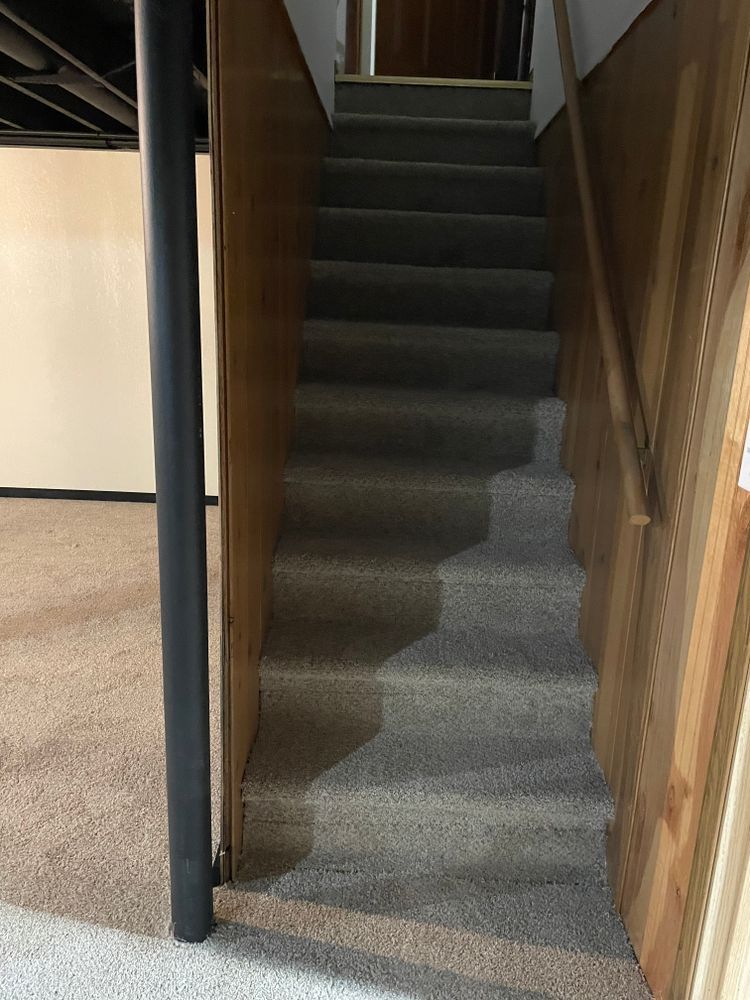 A set of stairs leading up to a basement in a house