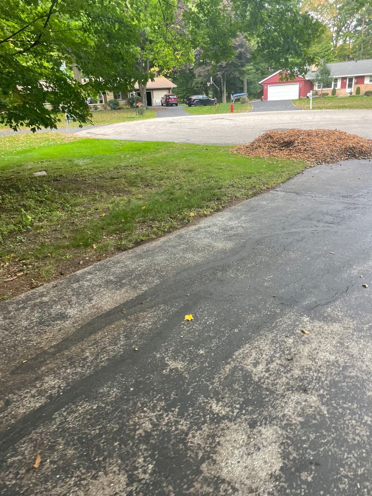 There is a pile of mulch on the side of the road