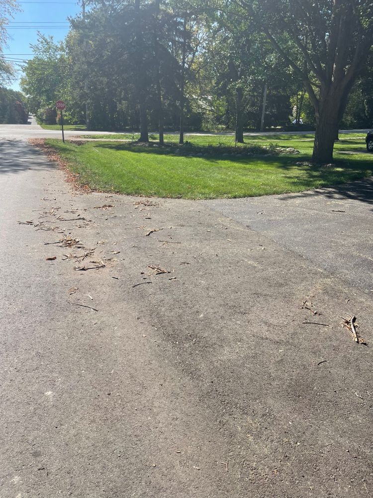 A road with a grassy area on the side of it