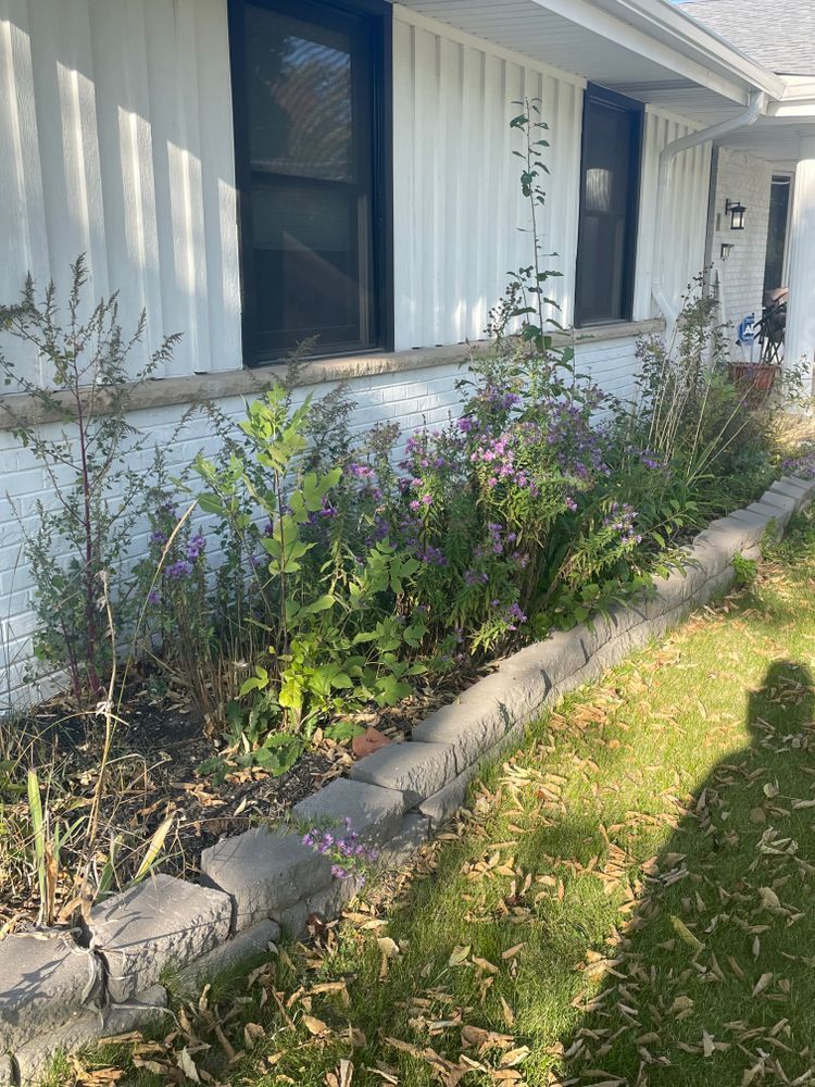 A white house with a garden in front of it