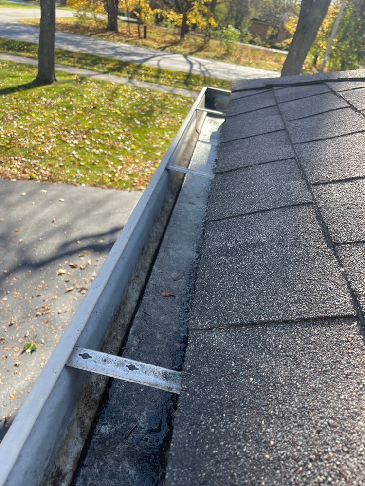 A close up of a gutter on top of a roof