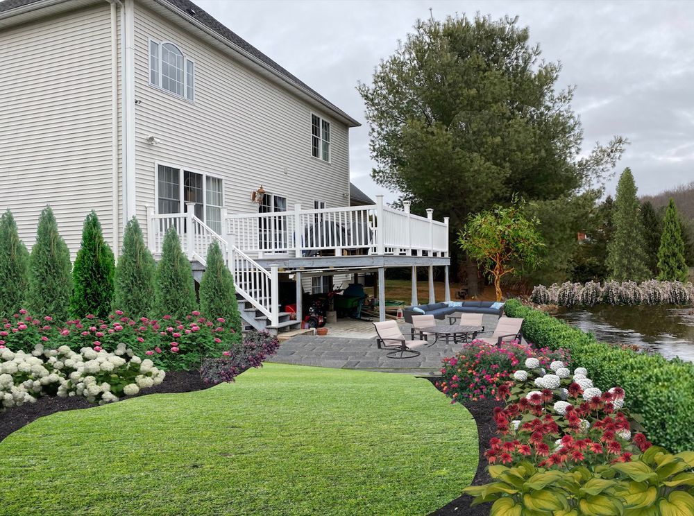 The backyard of a house with a large deck
