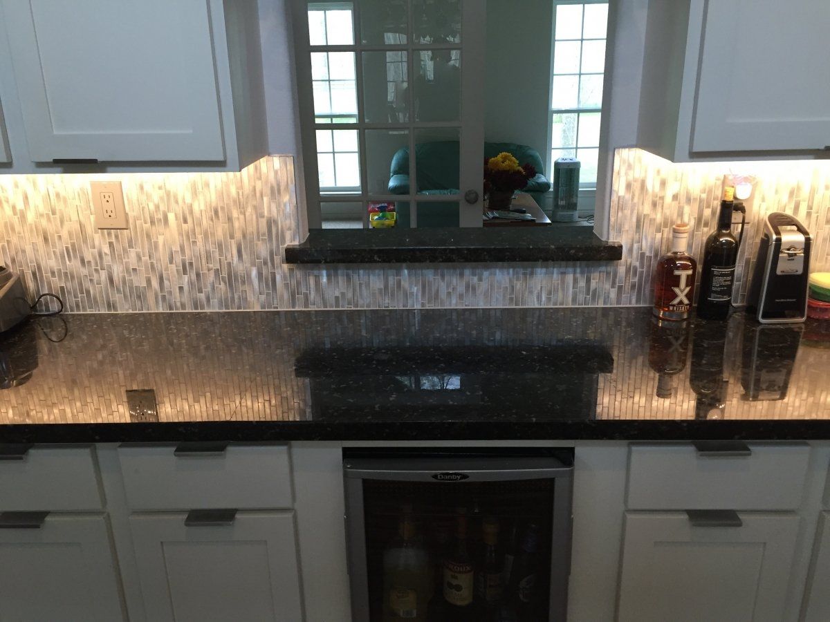 Kitchen Design & Remodeling — Kitchen Remodel With Black Worktops in Stafford, TX