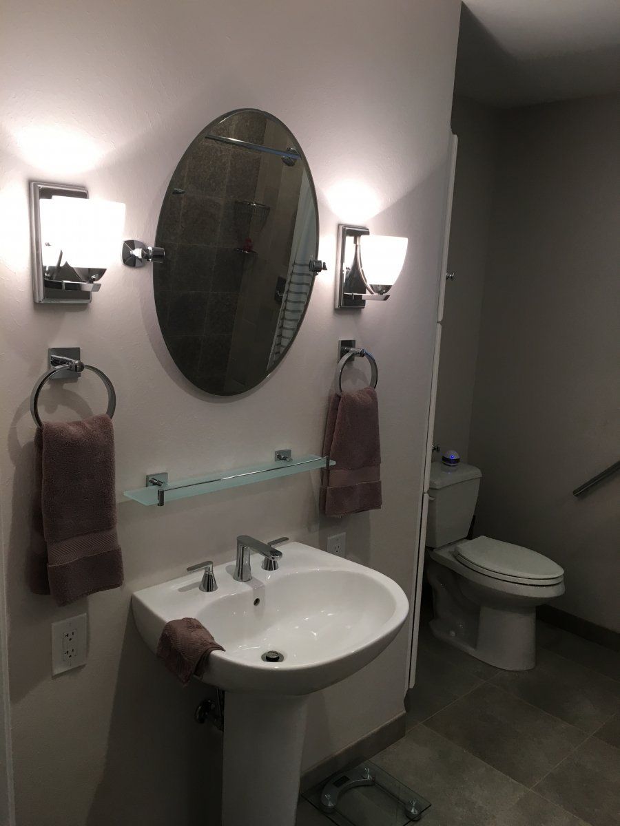 Mirror — Oval Mirror On The Bathroom in Stafford, TX