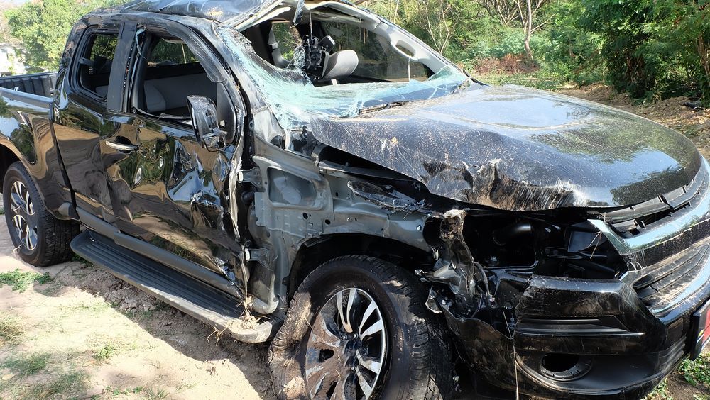 A Black Truck With a Broken Windshield is Sitting on the Ground — Smash Repairs In Taree, NSW