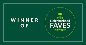 A green sign that says `` winner of neighborhood faves ''