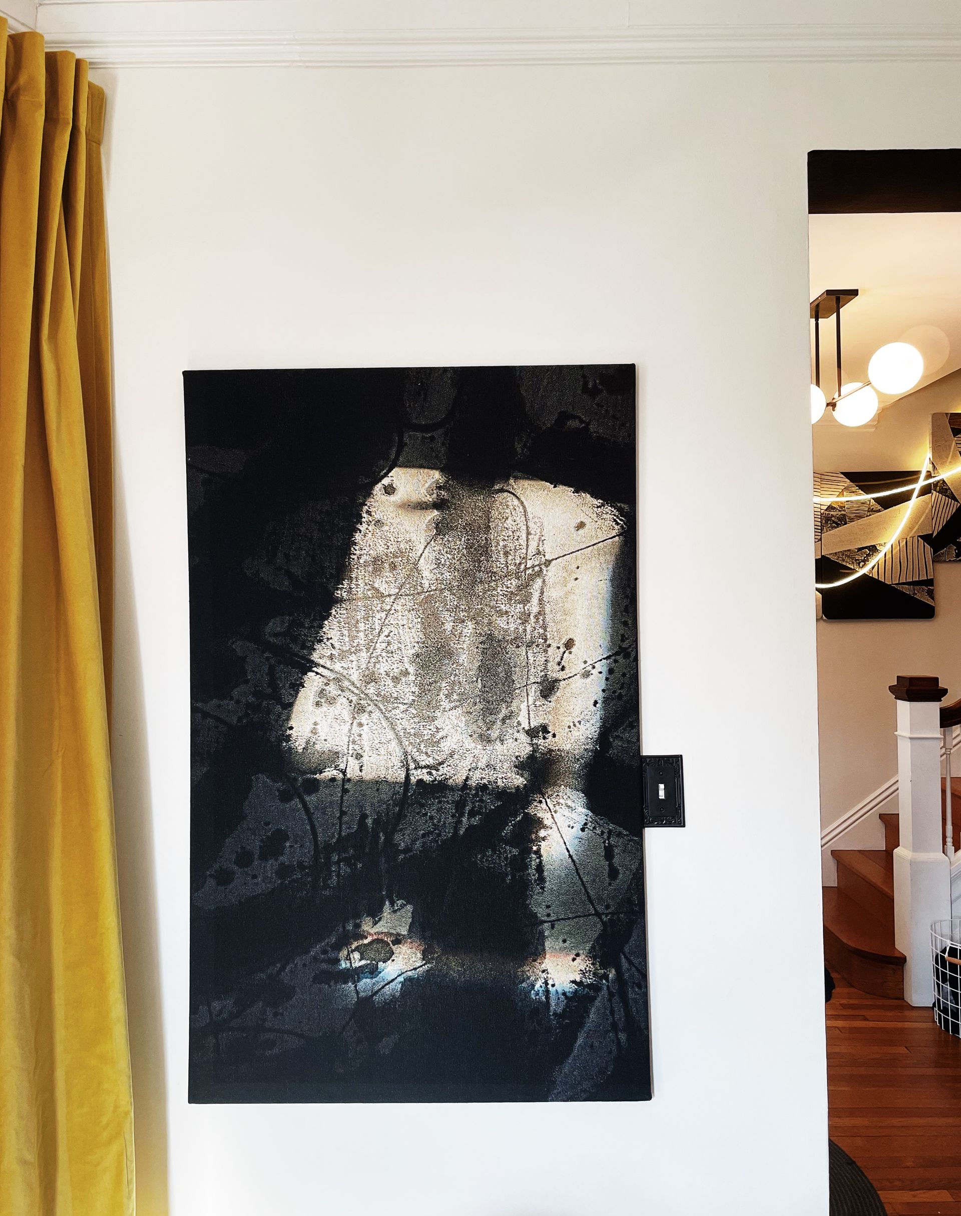 A painting on a wall with the number 1 on it