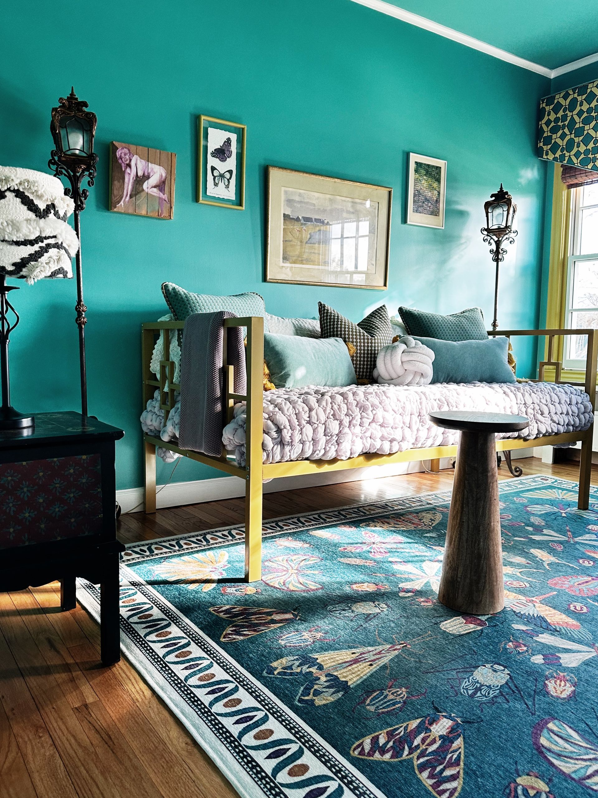 A living room with blue walls and a couch