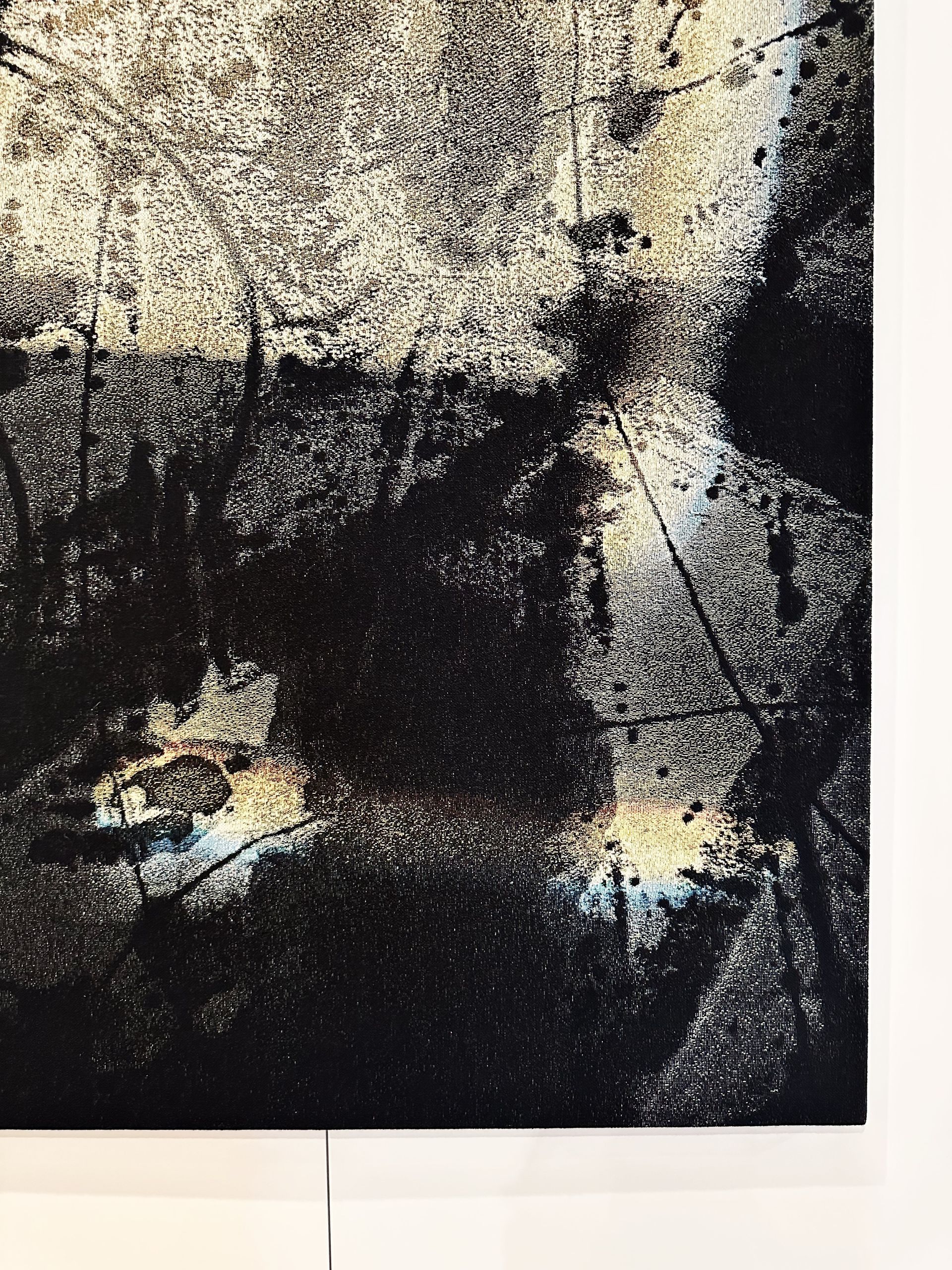 A black and white painting on a white wall