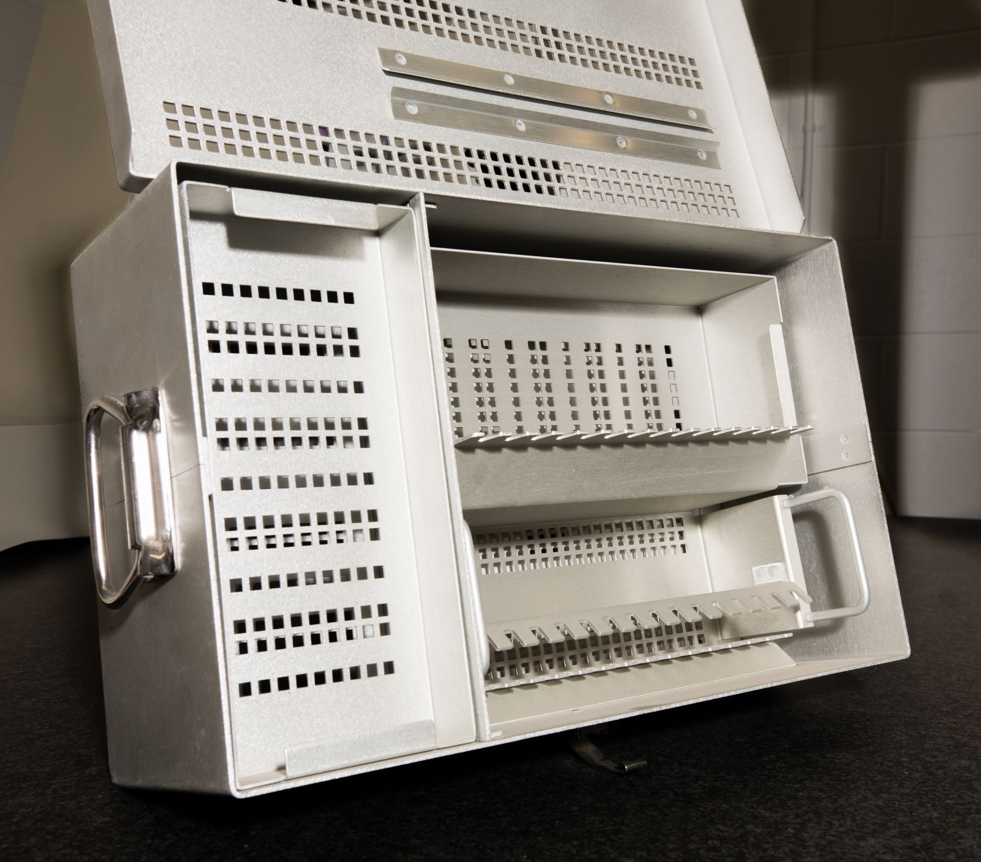 A white box with a handle on the side of it