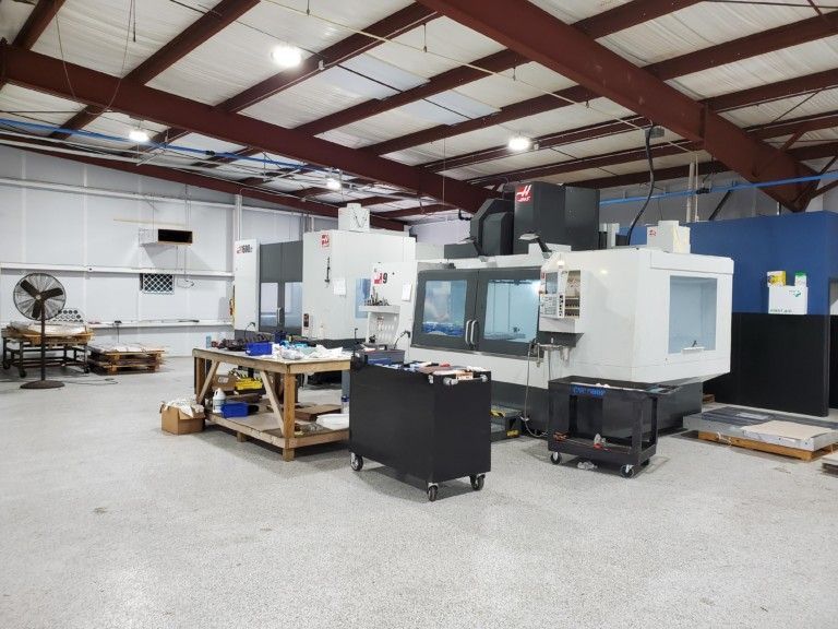 A warehouse with a lot of machines in it
