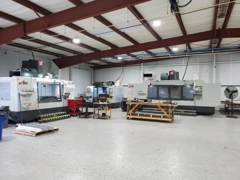 A large room with a lot of machines in it
