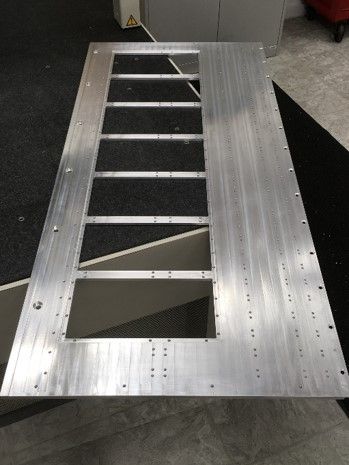 A large piece of metal is sitting on top of a table.