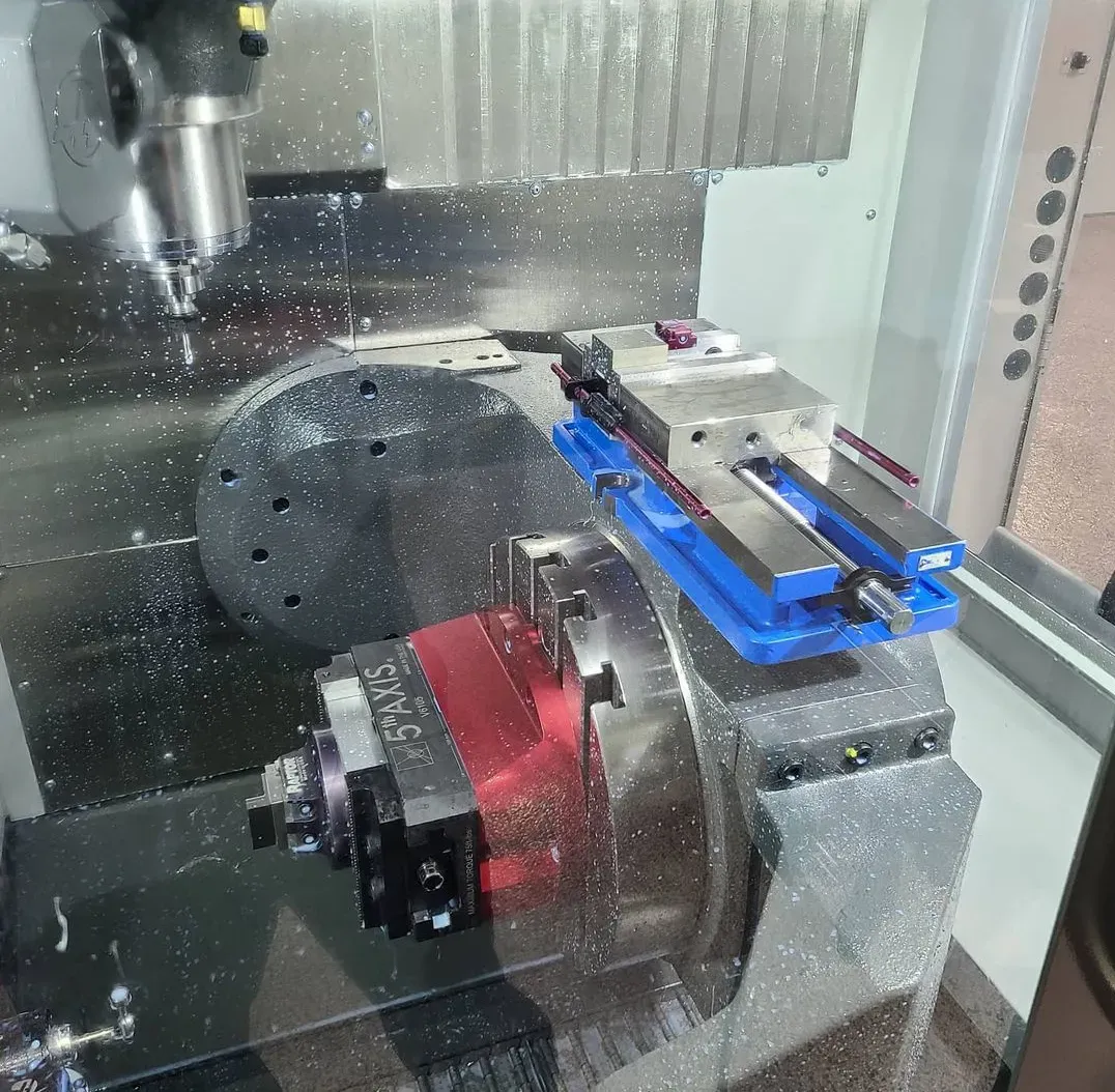 A machine with a blue vise that says smts on it