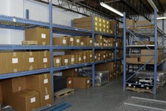 A warehouse filled with lots of boxes and shelves.