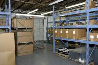 A warehouse filled with lots of boxes and shelves.