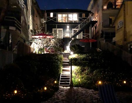 A row of eden trucks are parked in a parking lot.
